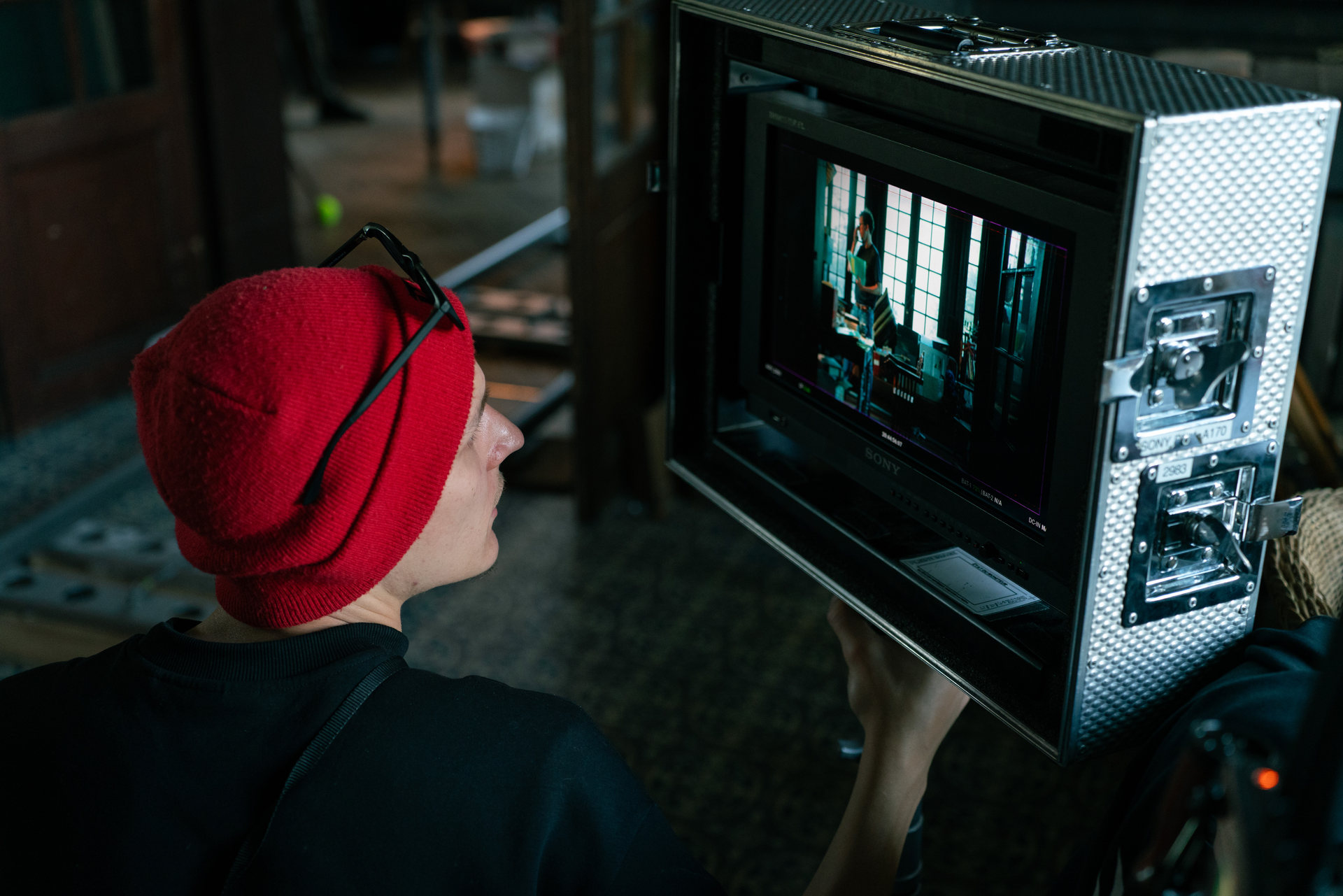 Max Decamps watching the monitor on set